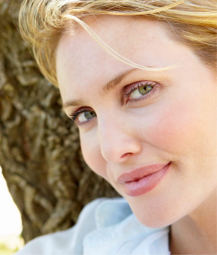 Woman with blonde hair and blue eyes