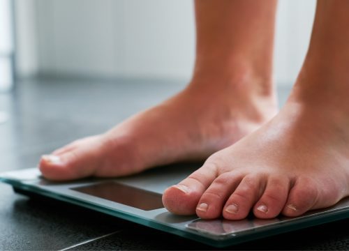Feet on a scale obesity